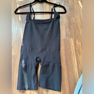SKIMS black bodysuit to thigh